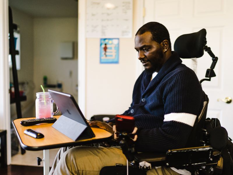 disabled man working from home in a wheelchair